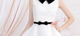 Девушка в белом коротком платье с пышной юбкой