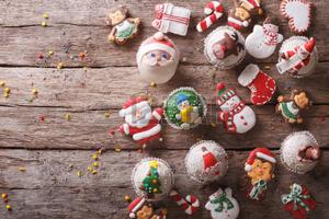 Background of Christmas sweets on a wooden table. horizontal view from above